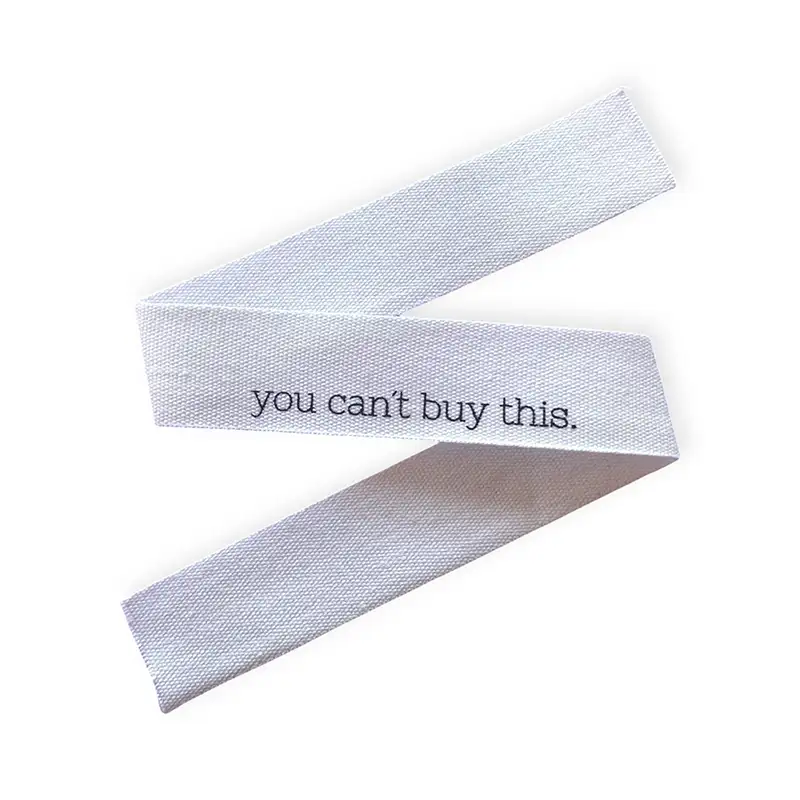 Baumwoll-Halsnaht-Band mit der Aufschrift you can't buy this