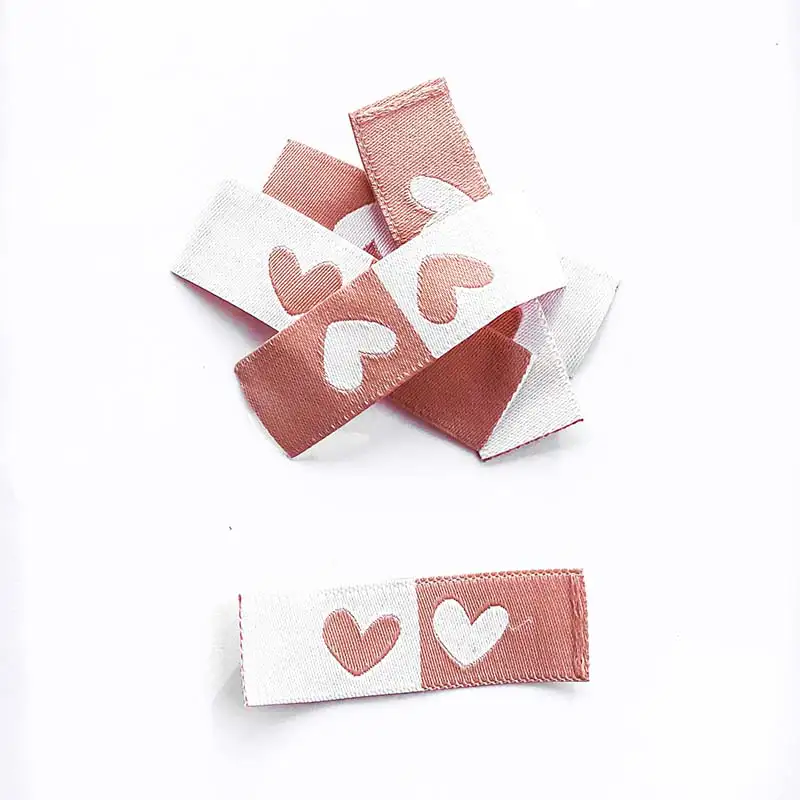 Weblabels beere und weiß mit Aufdruck Herz